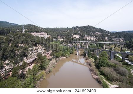 Llobregat River. Aerial View. Bridges And Fields