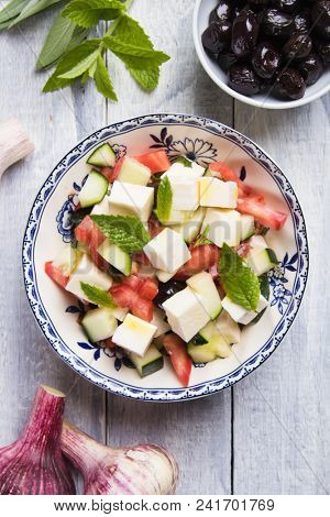 Greek salad with feta cheese cubes and fresk vegetables