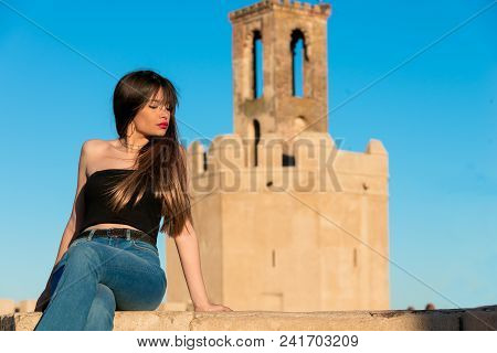 Beautiful Young Woman Front Espantaperros Tower In Badajoz.