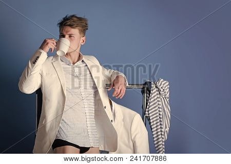 Elegant Man In Suit. Man Drinking From Cup. Macho Wearing Shirt, Jacket And Underpants. Model With M