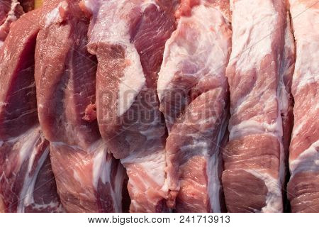 Raw Fat Cuting Pieces Of Pork On Wooden Background. Piece Of Fresh Boneless Pork, Neck Part Or Colla
