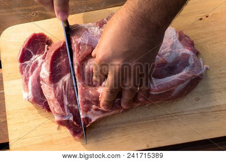 Overhead View Of Raw Piece Of Pork On Wooden Background. Piece Of Fresh Boneless Pork, Neck Part Or 