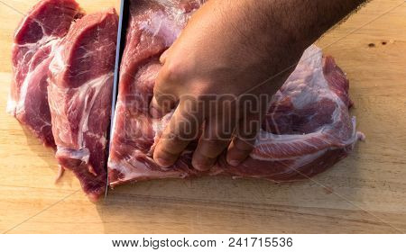 Overhead View Of Raw Piece Of Pork On Wooden Background. Piece Of Fresh Boneless Pork, Neck Part Or 