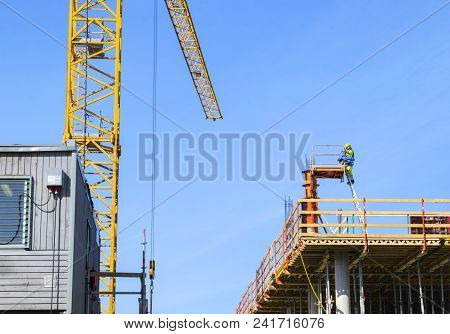 Construction Crane Tower On Blue Sky Background. Crane And Building Working Progress. Worker. Empty 