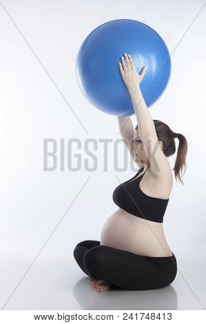 Pregnant Woman Is Doing Exercises With Gymnastic Ball On White Background