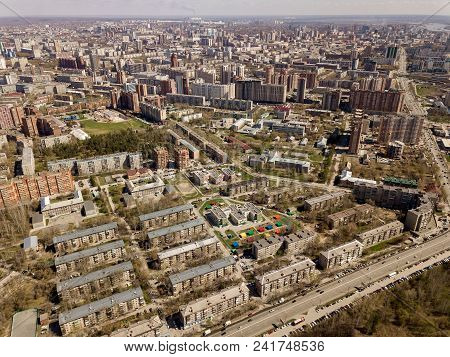 Forest In The Novosibirsk City,siberia With Diffrent Trees And Plants With Some Buildings In It. Str