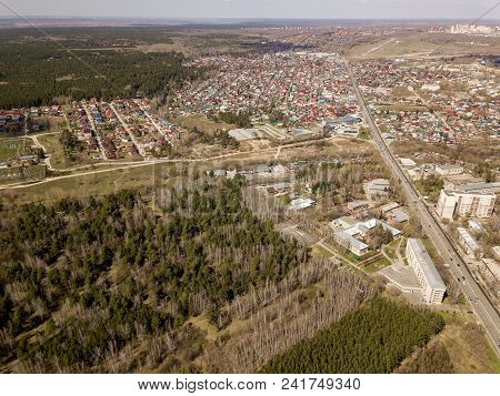 Forest In The Novosibirsk City,siberia With Diffrent Trees And Plants With Some Buildings In It. Str