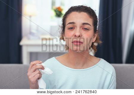 Flu Prevention. Young Absent Minded Sick Looking Woman Having Forgotten To Take Her Annual Precautio