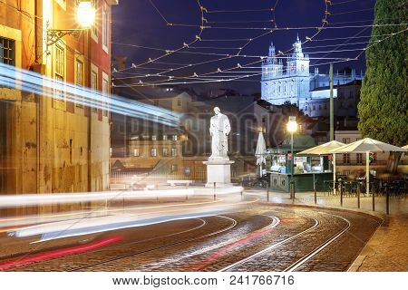 Night Empty Street With Tram Rails And Light Tracks, Statue Of Saint Vincent And Monastery Of Sao Vi