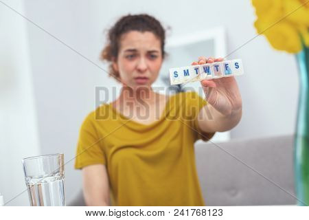 Pill Week. Adolescent Woman Looking Unhappy Having Receiced A Full Week Course Of Medication