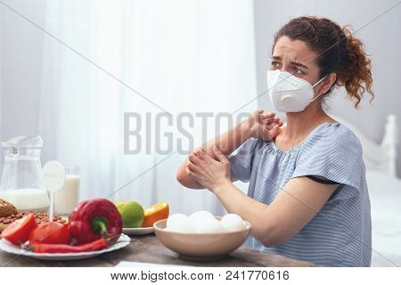 Reason In Food. Adolescent Lady Looking Worried Experiencing Allergic Itchiness On Her Elbow Caused 