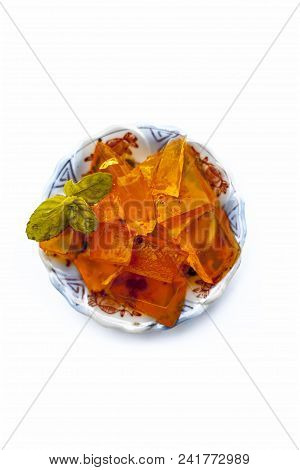 Orange Colored Halwa Grass Or China Grass Or Jelly In A Plate With Mint Leaves A Sweet Dessert Eaten
