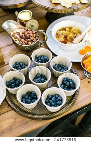 Housemade, Meal, Dessert Concept. Table Setting With Numbers Of Such Treats As Nuts, Blueberry, Drie