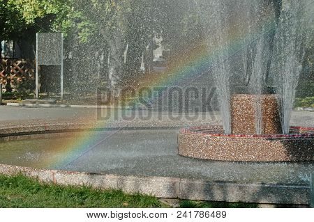 View Of Many Fountain With Different Programme And Rainbow  In The Public Zaimov Or Oborishte Park  