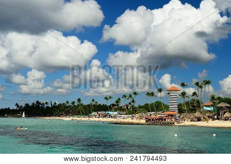 Relaxing Tourist Swimming On The Dominicus Beach On Dominican Republic. Coast Of The Del Este Nation