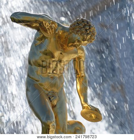 PETERHOF, ST. PETERSBURG, RUSSIA - MAY 10, 2018: Golden statues of the Grand Cascade. The cascade was built in 1715-1724 and is one of the remarkable fountain constructions in the world