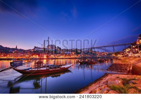 Porto, Portugal - May 18, 2018: Porto, Old Town Skyline With The Douro River And Rabelo Boats. Is Th