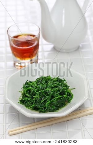 chinese white wine stir fried with toothed bur clover, shanghai cuisine