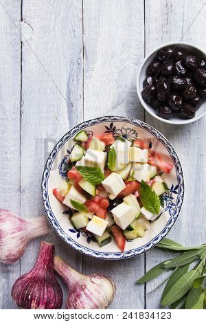 Greek salad with feta cheese cubes and fresk vegetables