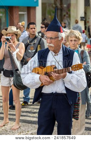 Funchal, Portugal - April 19, 2018:  Folk Musicians And Dancers Performing On The Avenida Arriaga  I