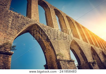 Rural landscape with ancient landmark aqueduct of Tomar region in Portugal