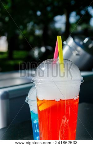 Plastic Cups With Sparkling Fresh Fruit Lemonades With Straw On The Street Food Festival Bright Sunn
