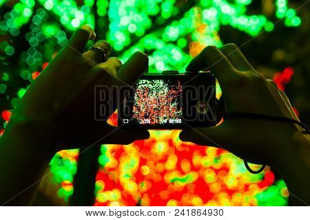 Camera Taking Photos Of Led Light In Background Creating Bokeh.