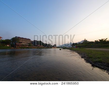 Sunset At Riverside With Mountain Background , Travel In Vang Viang City, Laos. 5Th December, 2013.