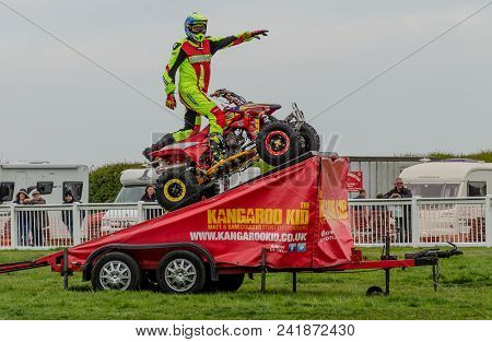 Anglesey, Uk: Feb 20, 2018: The Kangaroo Kid Display Team Perform Stunts Using A Quad Bike At The An