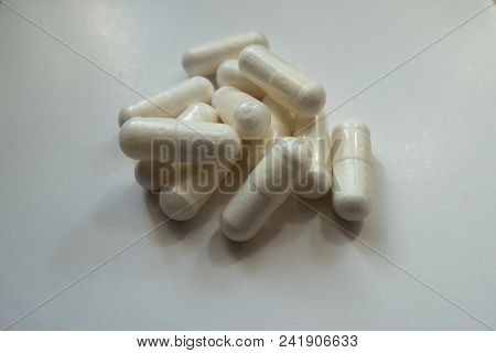 Closeup Of Heap Of White Capsules Of Magnesium Citrate