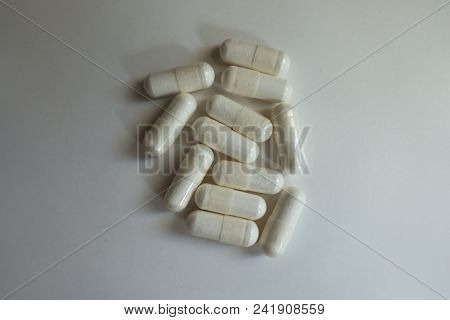 View Of White Capsules Of Magnesium Citrate From Above