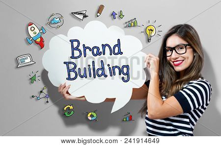 Brand Building Text With Young Woman Holding A Speech Bubble
