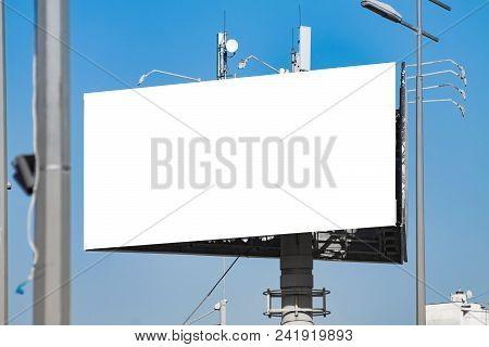 Blank Horizontal Billboard Against A Blue Sky.