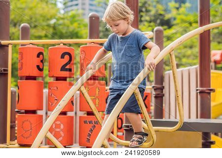 Funny Cute Happy Baby Playing On The Playground. The Emotion Of Happiness, Fun, Joy.