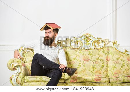 Macho Sits With Open Book On Head, Like Roof. Guy, Teacher Overdid With Teaching, Became Crazy Profe