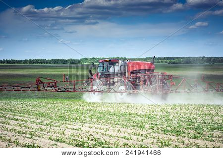 Vinnitsa/ukraine - 05/22/2018: Self-propelled Sprayer Makes Herbicide On The Field Of Young Corn