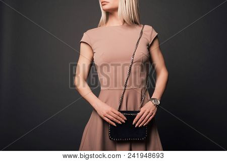 Close-up Of Unrecognizable Woman With Beautiful Trendy Manicure Wearing Holding Small Black Fancy Ha