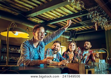 Sport, People, Leisure, Friendship, Entertainment Concept - Happy Male And Female Football Fans Or G