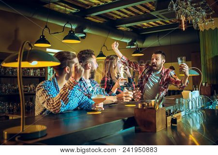 Sport, People, Leisure, Friendship, Entertainment Concept - Happy Male And Female Football Fans Or G