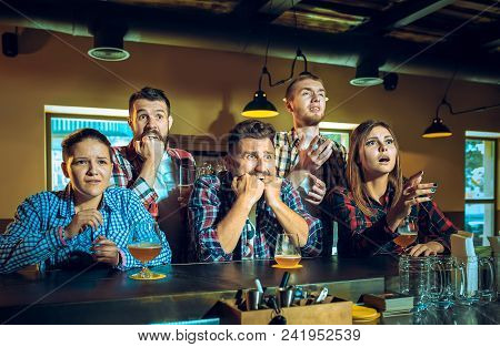Sport, People, Leisure, Friendship, Entertainment Concept - Happy Male And Female Football Fans Or G
