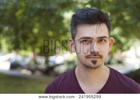 Young Man Outdoors Portrait With Copy Space
