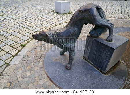 QUEDLINBURG, SAXONY-ANHALT/GERMANY - JULY 15, 2017: Dog Quedel statue guarding the city in the coat of arms in the figure is leving the socle as a sign that after war is nothing to guard anymore