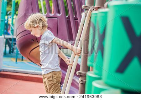 Funny Cute Happy Baby Playing On The Playground. The Emotion Of Happiness, Fun, Joy.