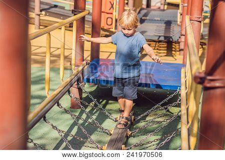 Funny Cute Happy Baby Playing On The Playground. The Emotion Of Happiness, Fun, Joy.