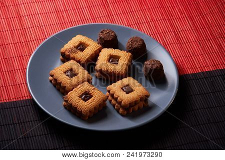 Chocolate Sand Chip Cookies Stacked Up On A Plate, Ready To Be Served.