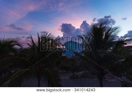 Perfect Equatorial Sunset. House In Darden. Pastel Pink Sky With Heap Clouds