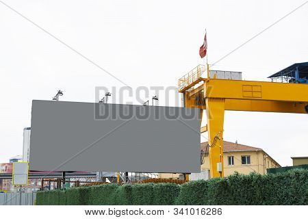 Close-up Advertising Sign. In Gray Background. Photographed On A Autumn Day.