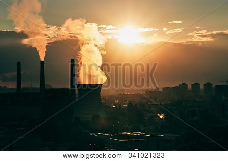 Industrial Cityscape Of Kyiv, Ukraine. Steam From Cooling Tower Of A Coal Power Plant And Smoke From