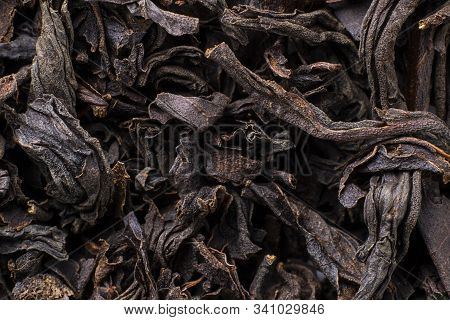 Black Tea Background. Fermented Leaves For Meking Helthy Hot Drink. Horizontal