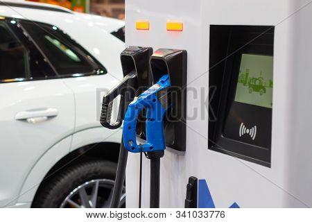 Modern Electrical Fast Charger To Electrical Or Hybrid Phev Automobiles. Future Energy Power. Ecolog